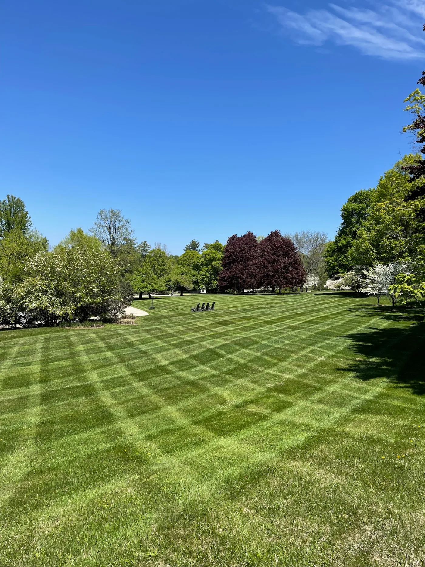 Estate maintenance work showing cared-for grounds and garden edges.
