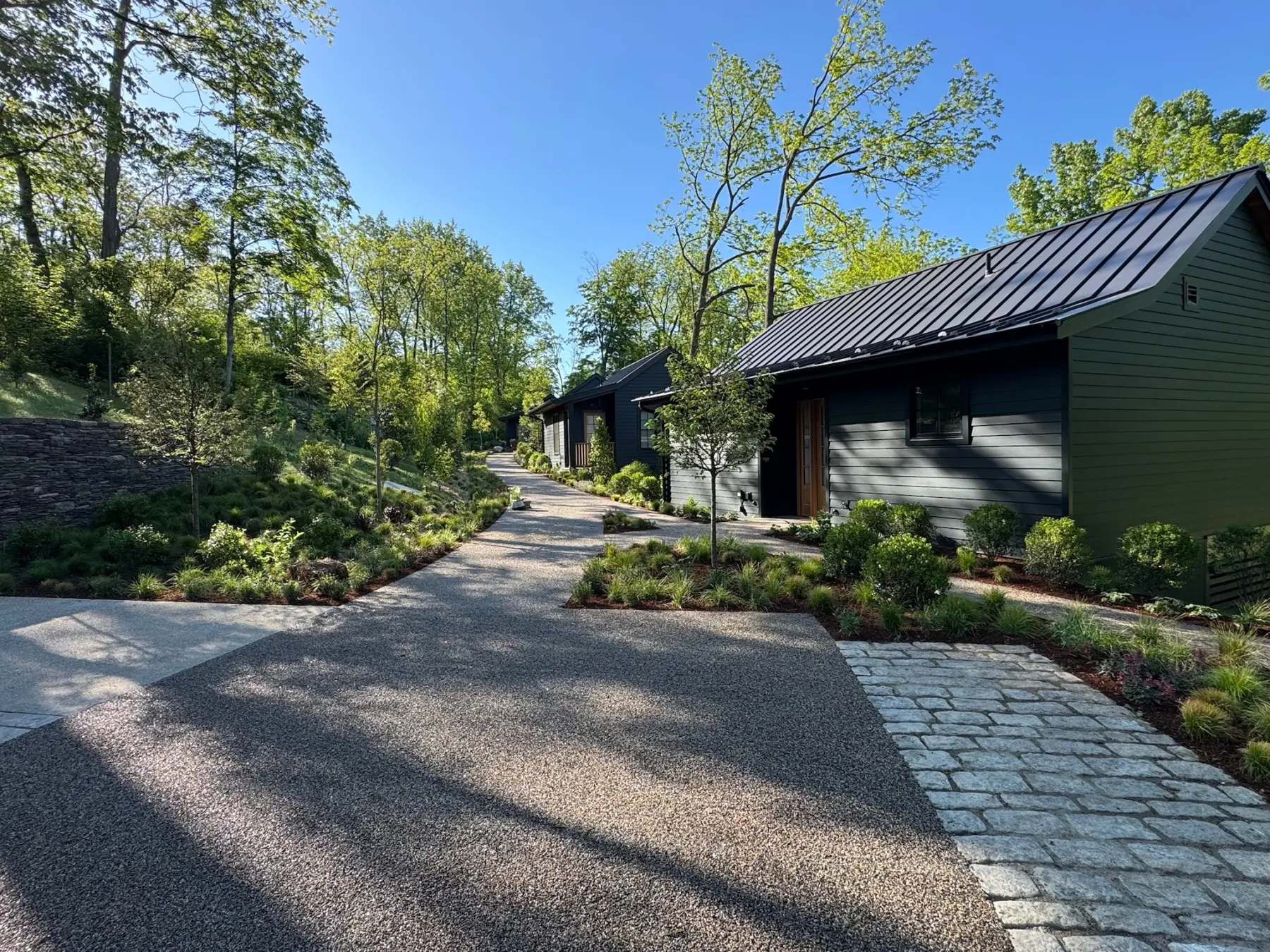 Layered planting beds and landscape presentation at a commercial guest-facing property.